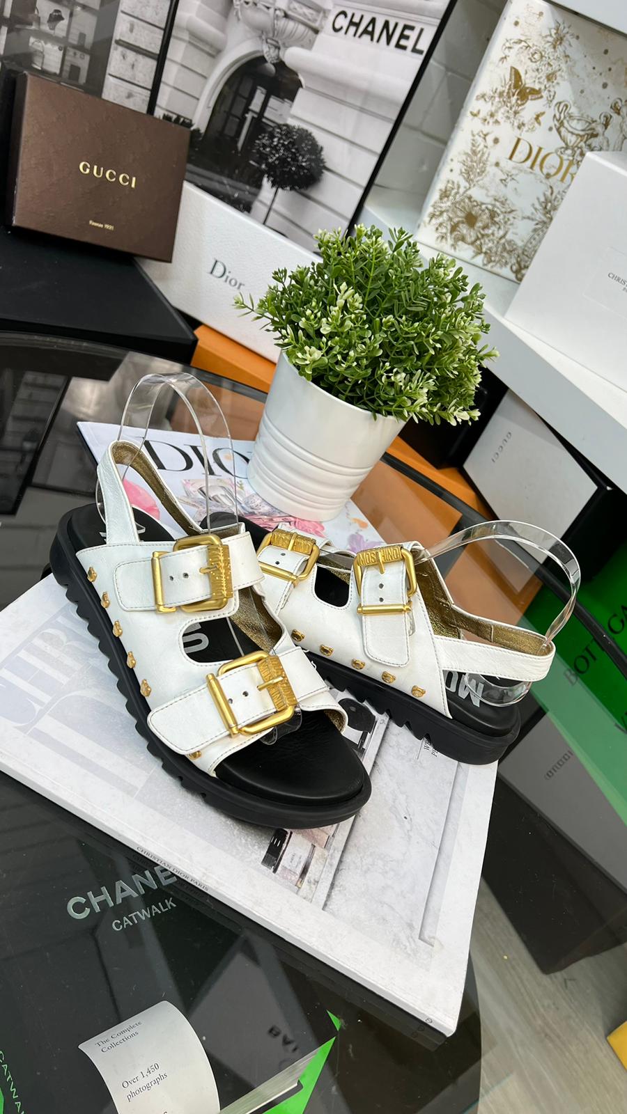 Moschino White And Gold Sandals
(U.K. 4)