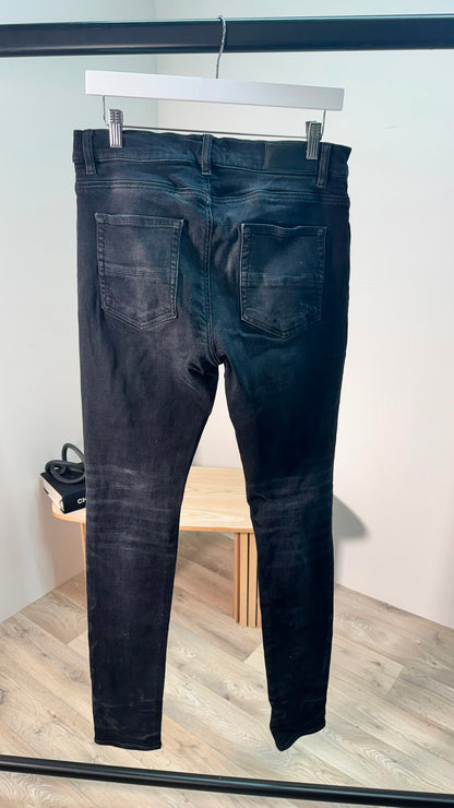 Amiri Black MX1 Distressed Patch Skinny Jeans – 32